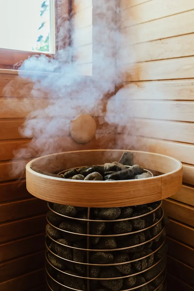 sauna with a basket of coal and smoke