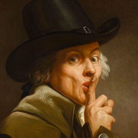 Portret of a man making silent sign with his finger.
